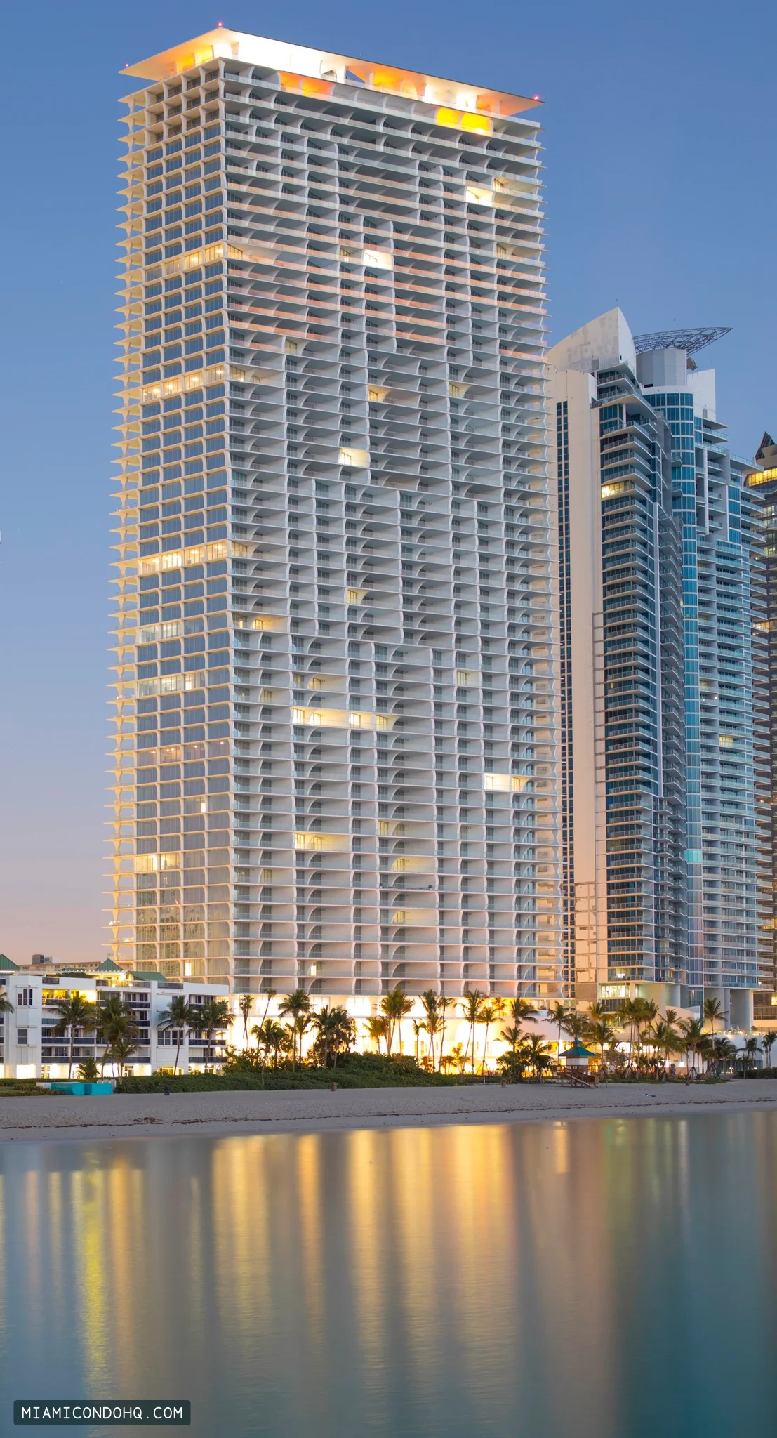 Jade Signature’s beachfront tower and reflections at dawn on March 19, 2018.