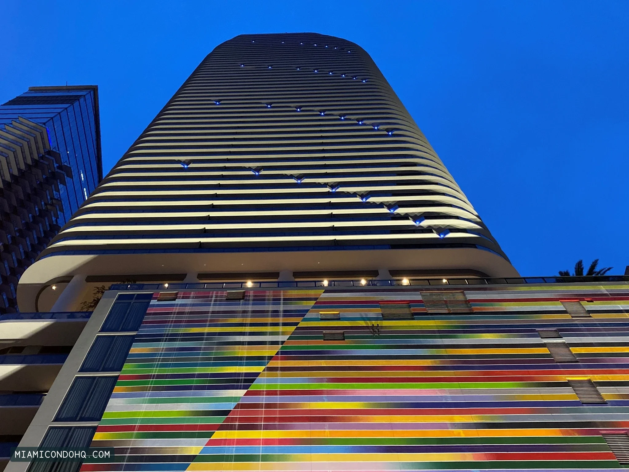 SLS Lux Brickell’s illuminated facade and colorful podium at dusk on October 18, 2019.