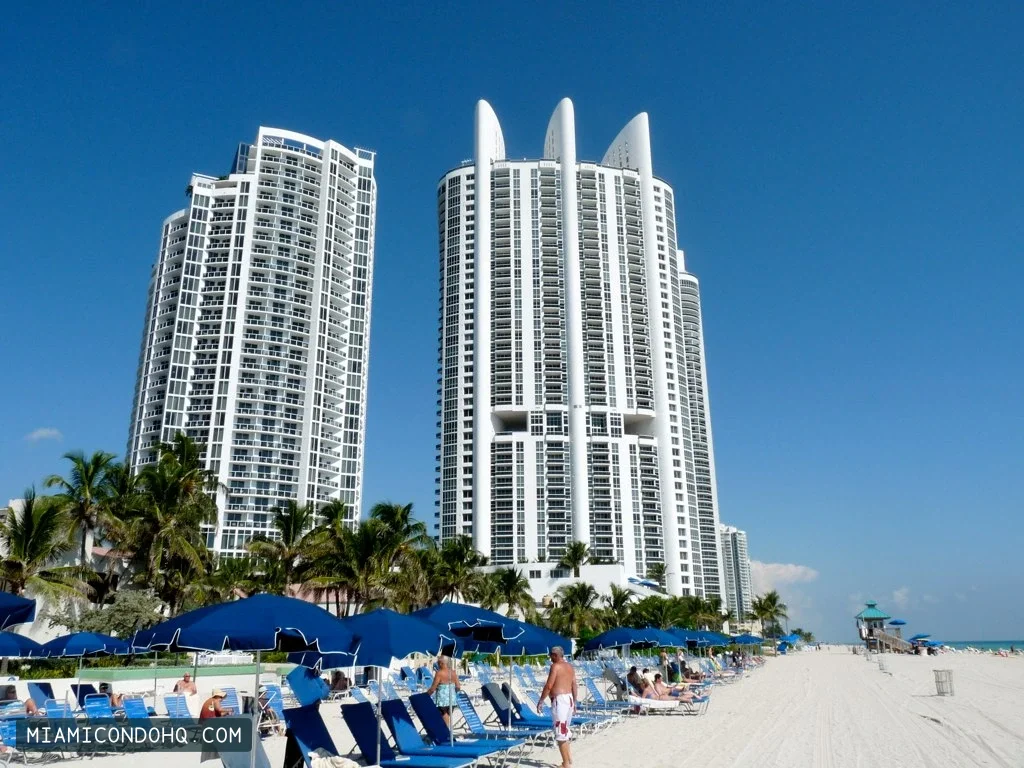 Trump Palace, the tower with three roof fins at right, beside the beach in October 2010.